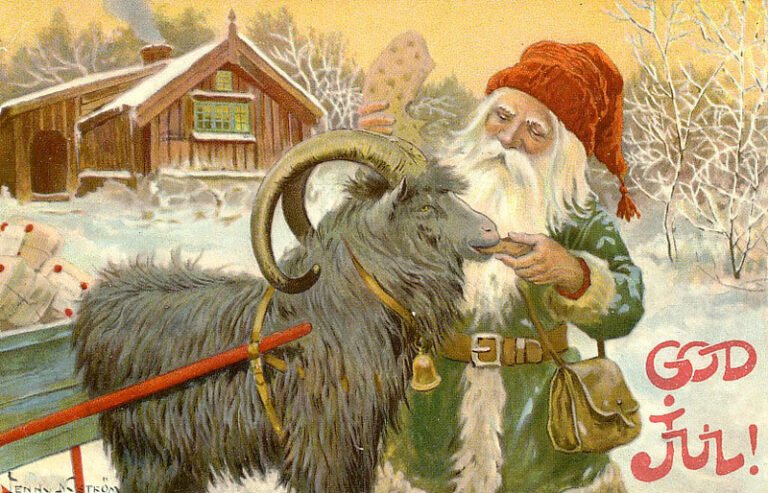 Santa Claus figure feeding bread to a Scandinavian julbock (Christmas goat) in a harness to a sleigh with presents in front of a small house.